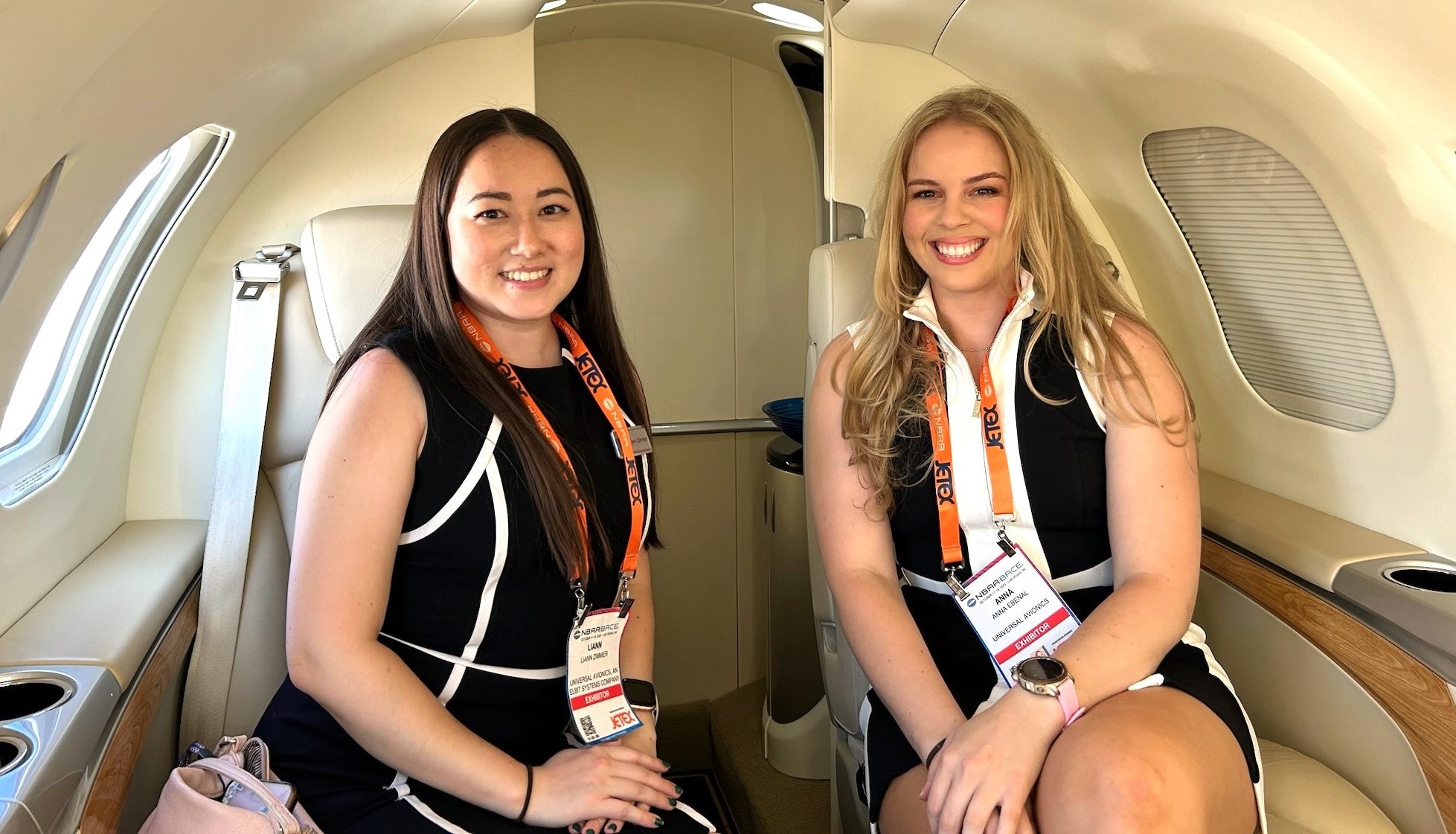 Anna Ebenal (right) pictured with Liann Zimmer (left) sitting inside of a business jet. 